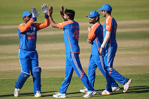 Indian players celebrate a wicket 